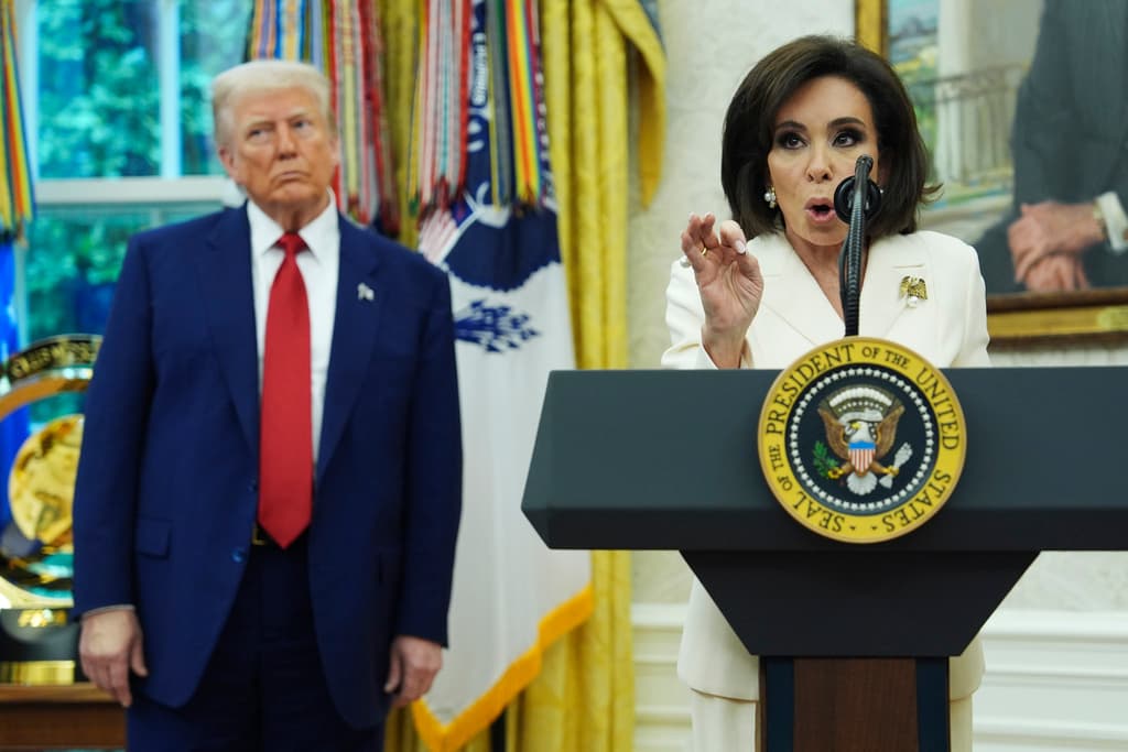 President Donald Trump, left, listens as Interim U.S. Attorney General for the District of Columbia Jeanine Pirro, right, speaks during her swearing in ceremony, Wednesday, May 28, 2025, in Washington. (AP Photo/Evan Vucci)