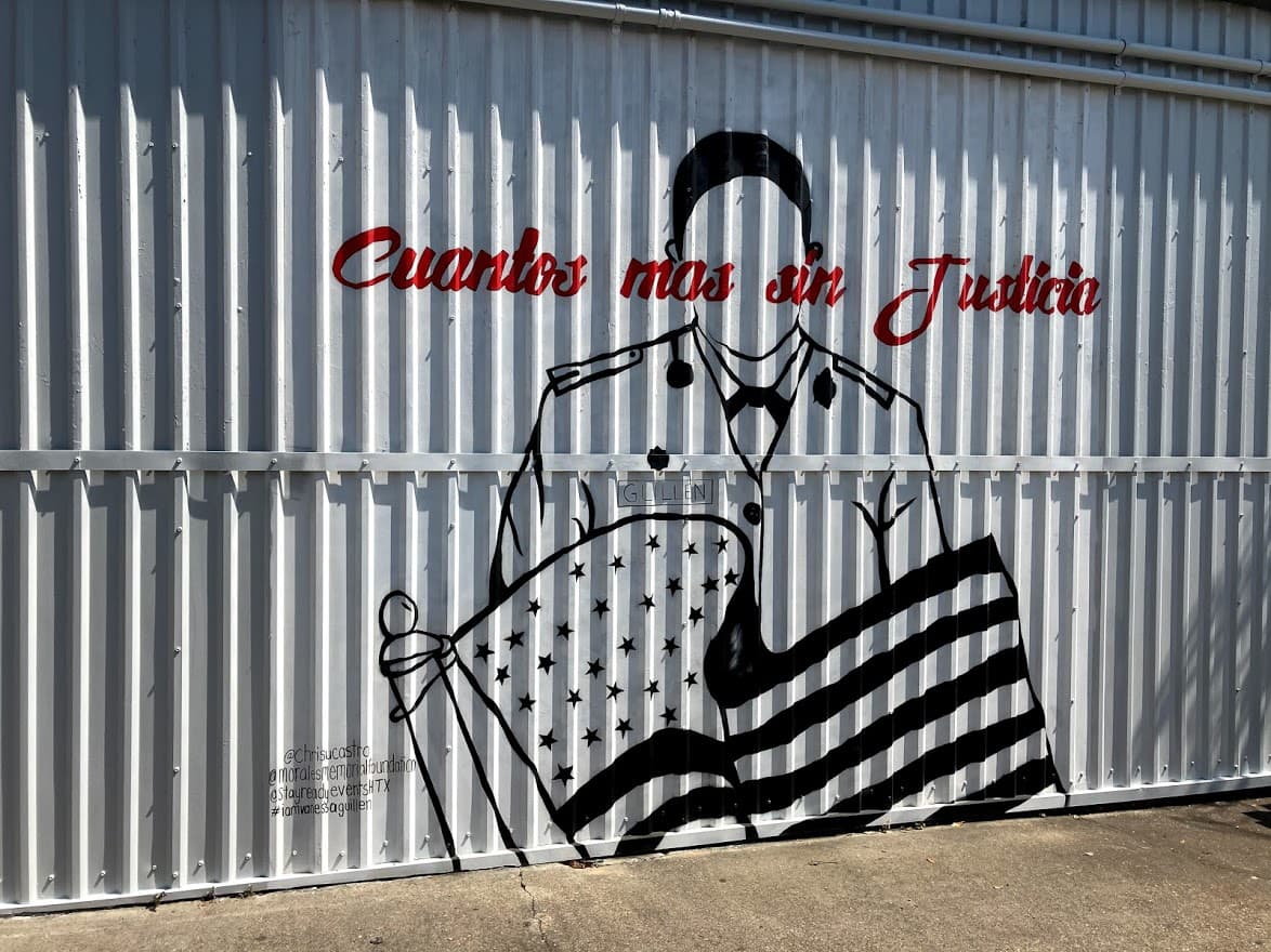 A mural by Chris Castro depicts a silhouette of Vanessa Guillén, with the words "Cuantos más sin Justicia", at the Morales Memorial Foundation on N Ennis St, Houston, Texas.