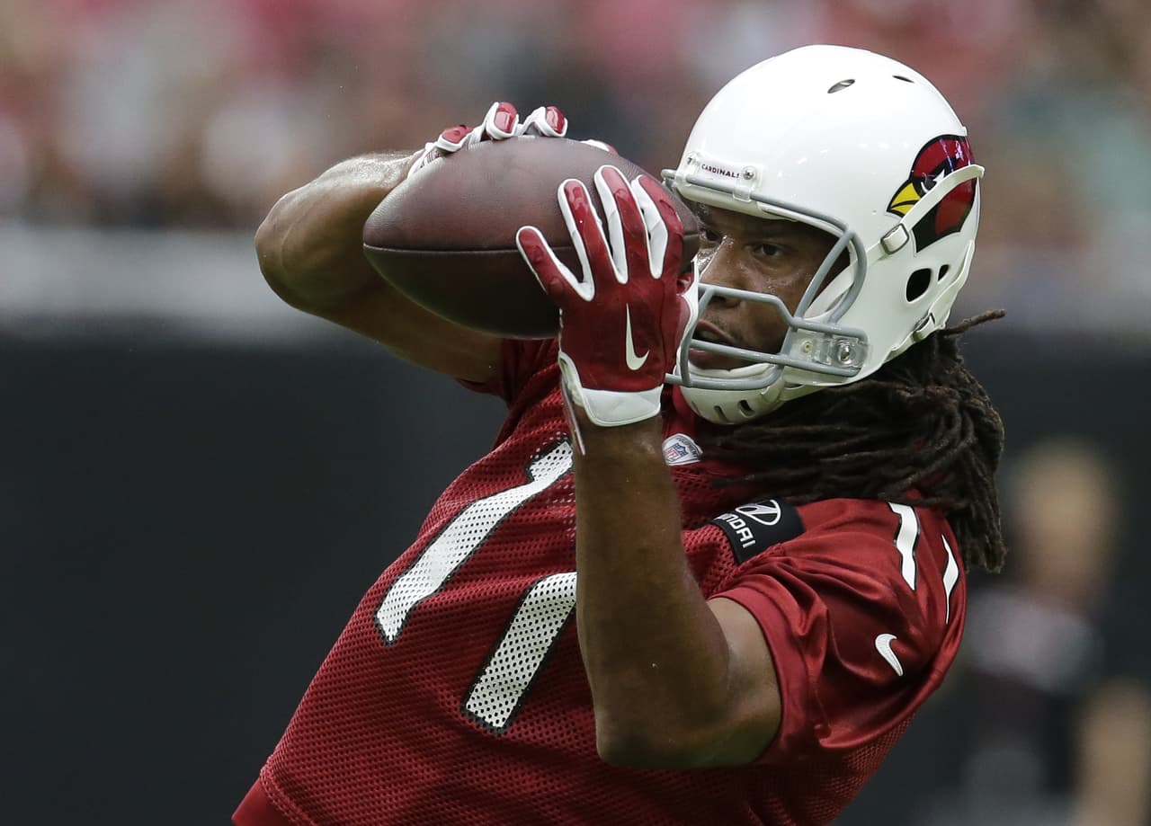 Arizona Cardinals wide receiver Larry Fitzgerald (11) works out during a Cardinals' camp, Saturday, July 22, 2017, in Glendale, Ariz. (AP Photo/Rick Scuteri)