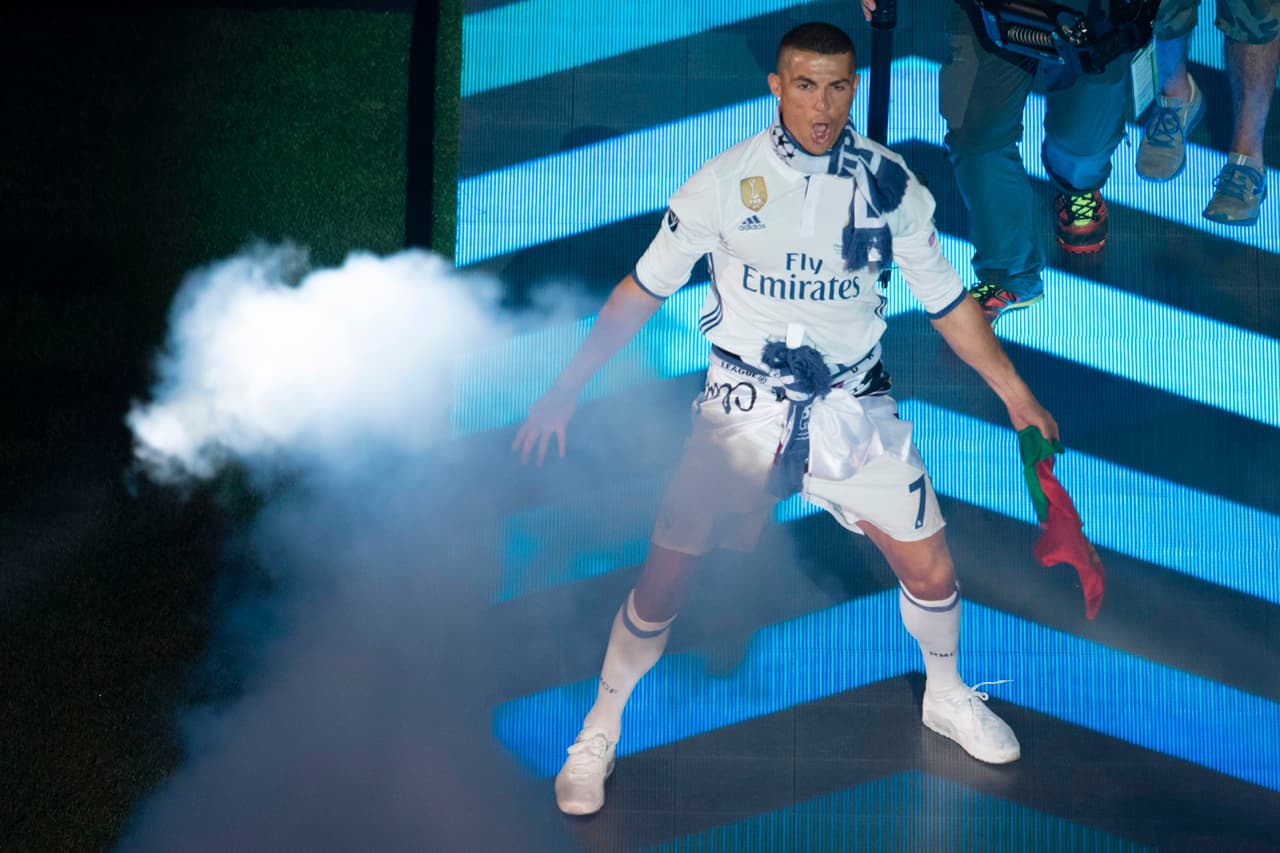 Real Madrid's Portuguese forward Cristiano Ronaldo jubilates during a celebration event held at the Santiago Bernabeu stadium after the team won the the UEFA Champions League football match final Juventus vs Real Madrid CF held at the National Stadium of Wales in Cardiff on June 3, 2017. / AFP PHOTO / CURTO DE LA TORRE (Photo credit should read CURTO DE LA TORRE/AFP/Getty Images)