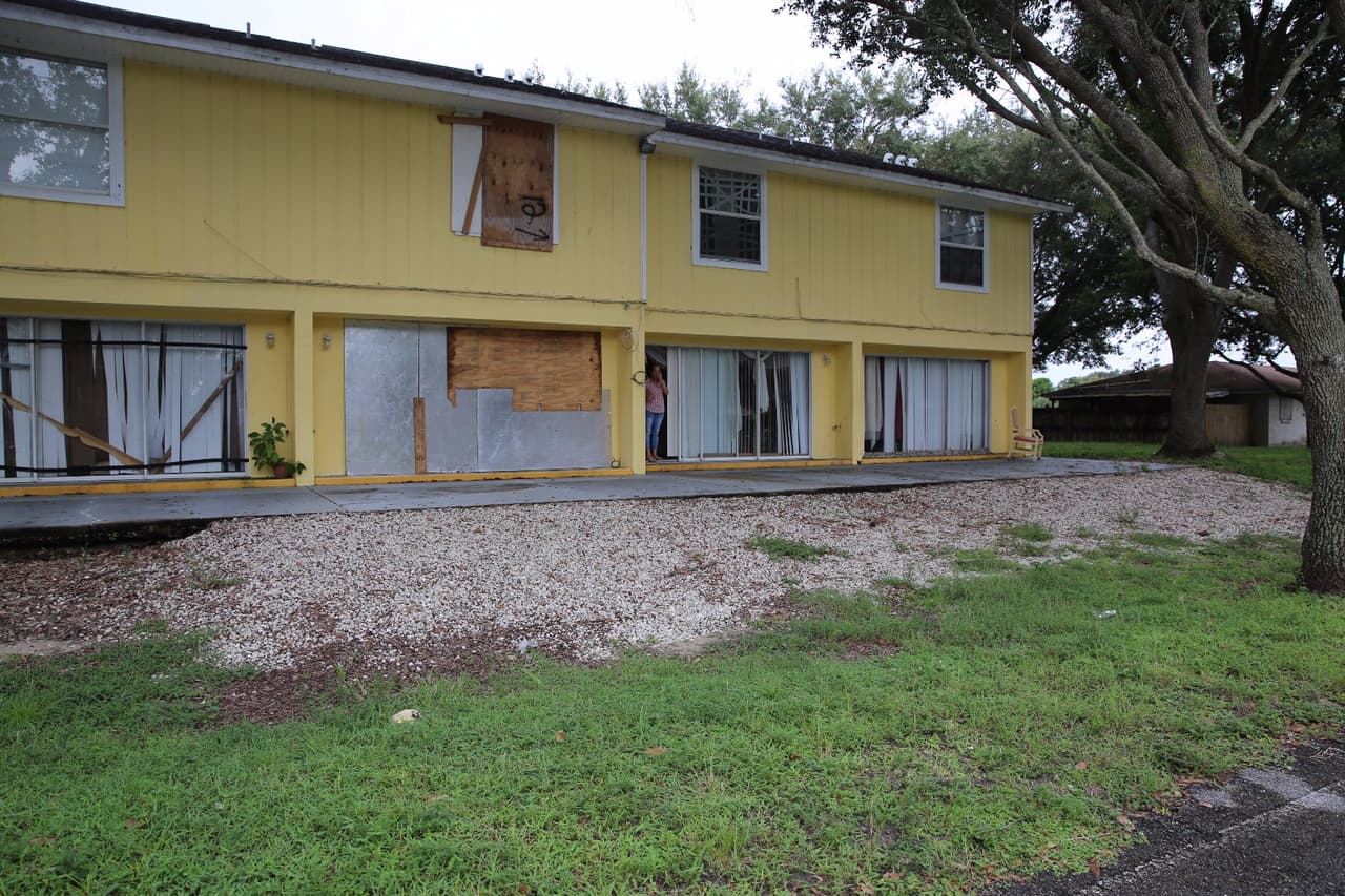 Residents in Golden Gate, a Hispanic barrio in Naples, used sheets of wood and metal to protect their homes.