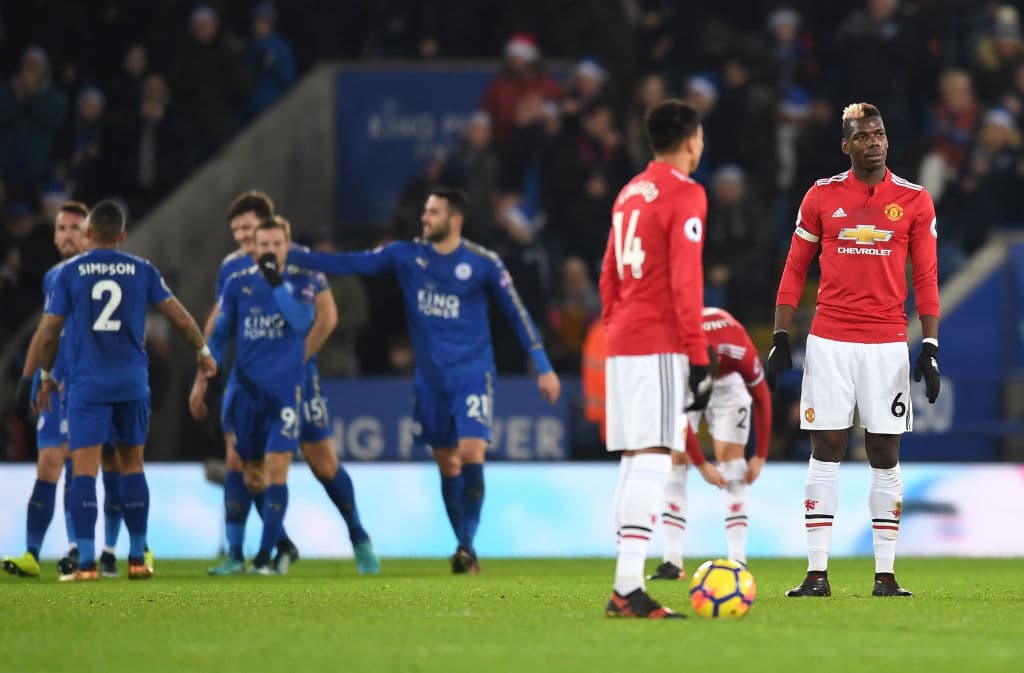 LEICESTER, ENGLAND - DECEMBER 23: Paul Pogba (R) of Manchester United looks dejected after the opening goal scored by Jamie Vardy of Leicester City during the Premier League match between Leicester City and Manchester United at The King Power Stadium on December 23, 2017 in Leicester, England. (Photo by Michael Regan/Getty Images)