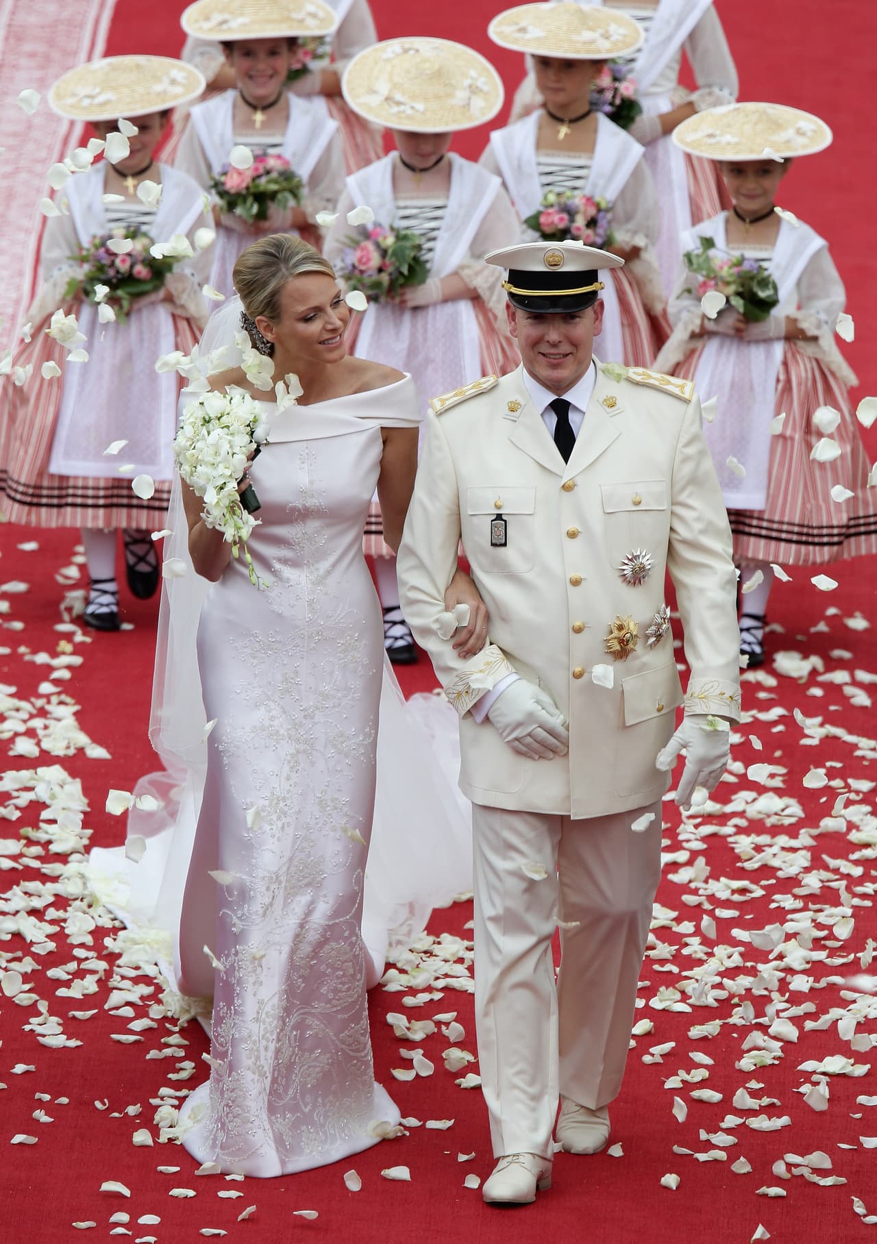 <b>2011 - Charlene Wittstock and Albert II of Monaco</b>
<br>Lest she be 
<a href="https://www.vogue.com/article/princess-charlene-monaco-look-back-at-her-romance-grace-kelly">eclipsed by</a> Kate’s wedding, the bride chose a design by Armani Privé made of 80 meters of silk organza, 40,000 Swarovski crystals and 20,000 mother-of-pearl teardrops in 2,500 hours’ work.