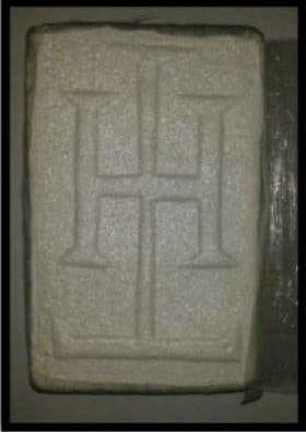 Some of the evidence against Hernandez includes weapons and cocaine stamped with his initials, 'TH.'