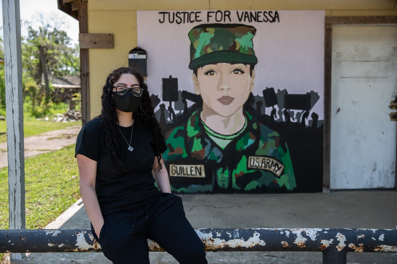 Samantha Valdez stands in front of the mural she painted at her neighbor's home on Canal St in Houston Texas.
