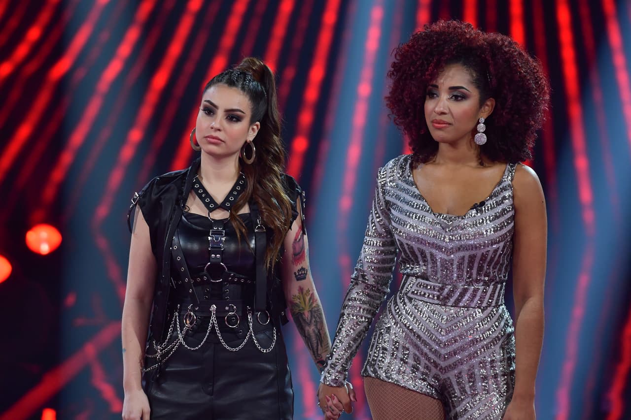 Para votar por tu favorita solo debes ingresar a 
<a href="https://www.univision.com/conecta" target="_blank">Univision Conecta</a>; emitir tu fallo por teléfono, llamando al 186-691-8880-1 si tu voto es para Giselle o al 186-691-8880-2, si tu voto es para Melaner. También puedes enviar un mensaje de texto con el nombre de tu favorita al 22854.