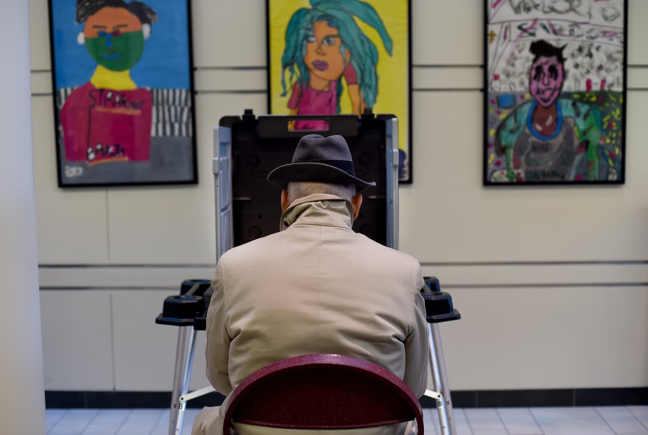 Voters cast their ballots in the presidential election at the Greenwich High School polling place in Greenwich, Connecticut November 8, 2016. After an exhausting, wild, bitter, and sometimes sordid campaign, Americans finally began voting Tuesday for a new president: either the billionaire populist Donald Trump or Hillary Clinton, seeking to become the first woman to win the White House. / AFP / TIMOTHY A. CLARY (Photo credit should read TIMOTHY A. CLARY/AFP/Getty Images)