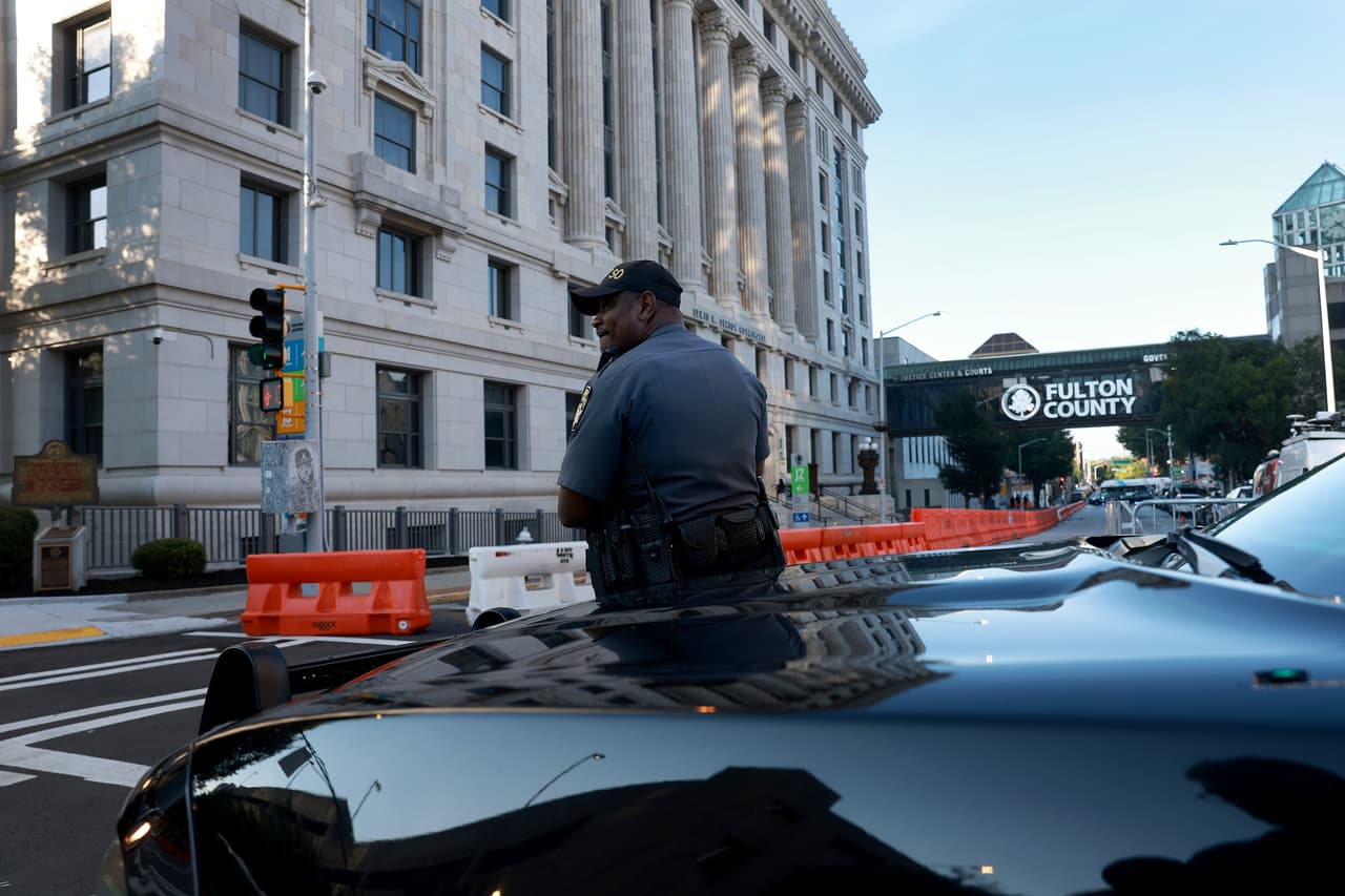 ATLANTA, GEORGIA - AUGUST 08: Fulton County Sheriff officers block off a street in front of the Fulton County Courthouse on August 08, 2023 in Atlanta, Georgia. The heightened security is in place as Fulton County District Attorney Fani Willis is expected to announce soon a possible grand jury indictment in her investigation into former President Donald Trump and his Republican allies' alleged attempt to overturn the 2020 election in the state. (Photo by Joe Raedle/Getty Images)
