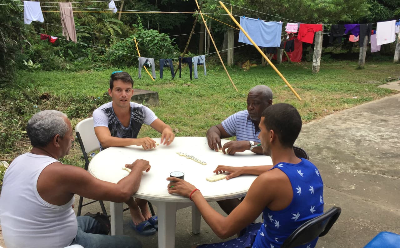Cuban migrants in Panama play dominoes at a Caritas shelter to kill time while they wait to find out of they will be allowed to continue their journey to the United States
