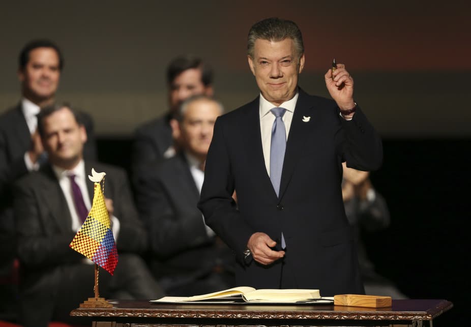 Colombia’s President Juan Manuel Santos prepares to sign a modified peace accord with FARC.