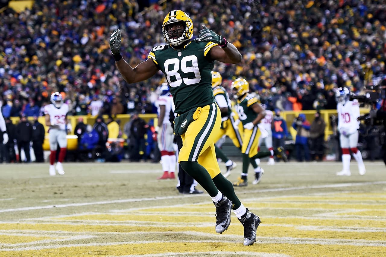 GREEN BAY, WI - JANUARY 8: Jared Cook #89 of the Green Bay Packers celebrates in the third quarter during the NFC Wild Card game against the New York Giants at Lambeau Field on January 8, 2017 in Green Bay, Wisconsin. (Photo by Stacy Revere/Getty Images)