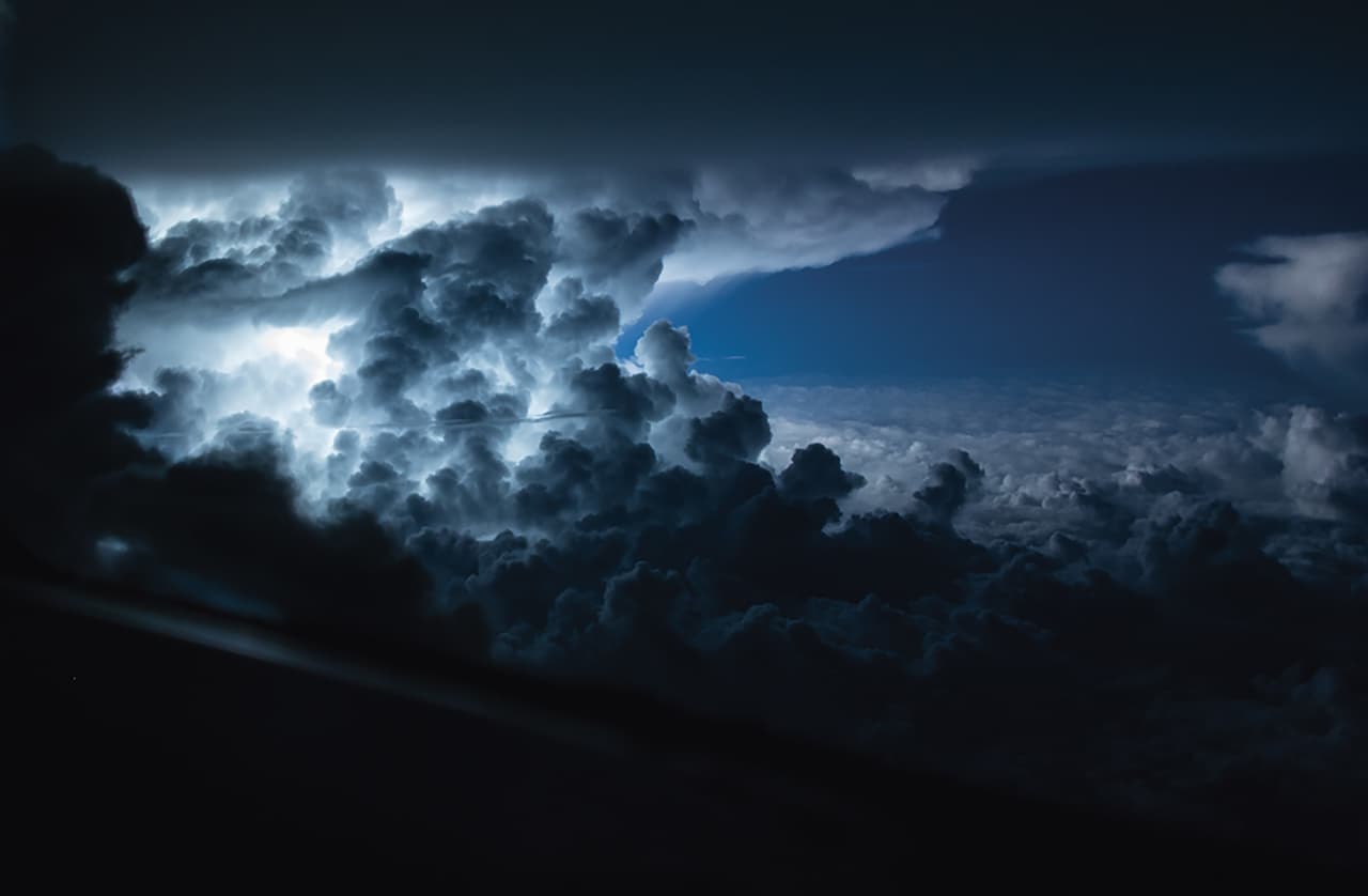 Santiago Borja is Ecuadorian and pilots commercial aircraft for a major airlines on routes to the Americas and Europe. For nine years he has worked in civil aviation and has been taking photographs for five years. In the picture a storm over the Atlantic Ocean, a few miles south of Jamaica, at 35,000 feet.