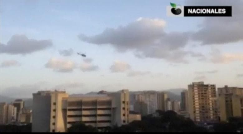 The scene over Caracas on Tuesday before sunset. As the blue police helicopter flew overhead gunshots could be heard. The government says four grenades were thrown from the helicopter but did not explode.