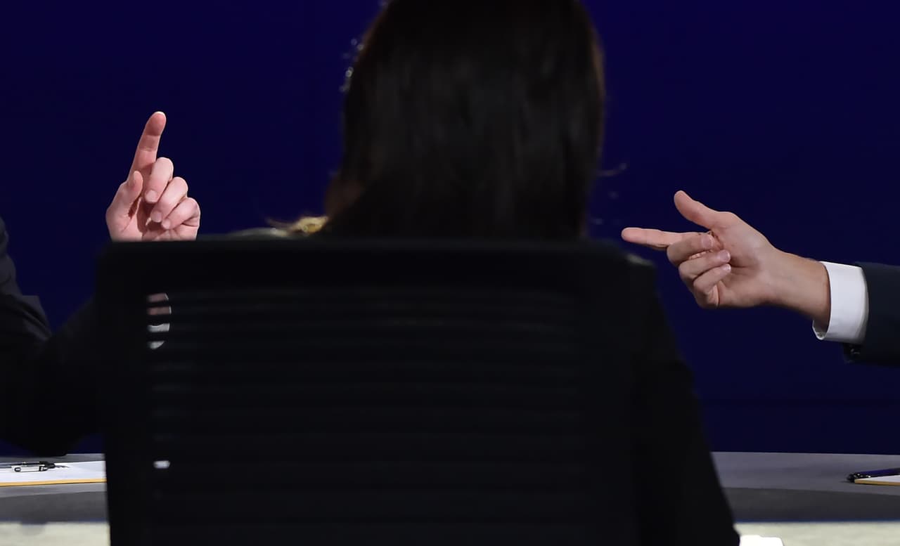 Democratic vice presidential candidate Tim Kaine (L) and Republican vice presidential candidate Mike Pence (R) take questions from moderator Elaine Quijano (C) during the US vice presidential debate at Longwood University in Farmville, Virginia on October 4, 2016. / AFP / Paul J. Richards (Photo credit should read PAUL J. RICHARDS/AFP/Getty Images)