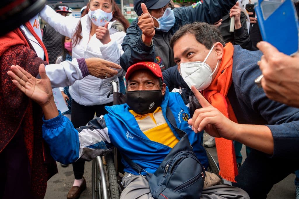 Ecuadoran Presidential candidate for "Union por la Esperanza" party Andres Arauz (R), takes a picture with a supporter during a campaign rally in northern Quito, on January 6, 2021.