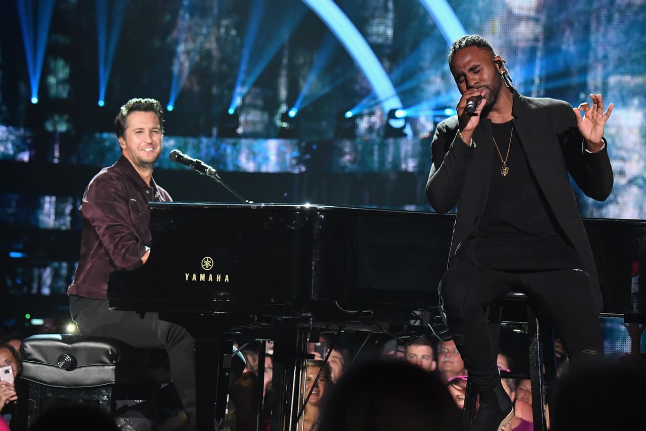Country singer Luke Brian plays the piano alongside hip hop singer Jason Derulo at the 2017 CMT Music Awards in Nashville, Tennessee on June 7. Derulo just teased that he has a country music project in the works.