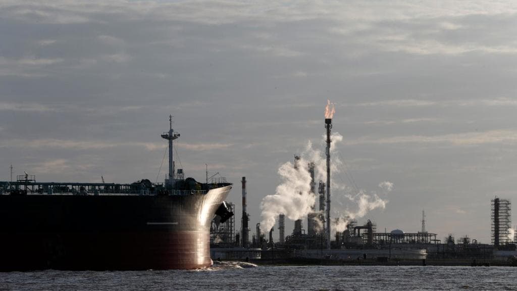 A ship passes a Louisiana refinery, March 5, 2018.