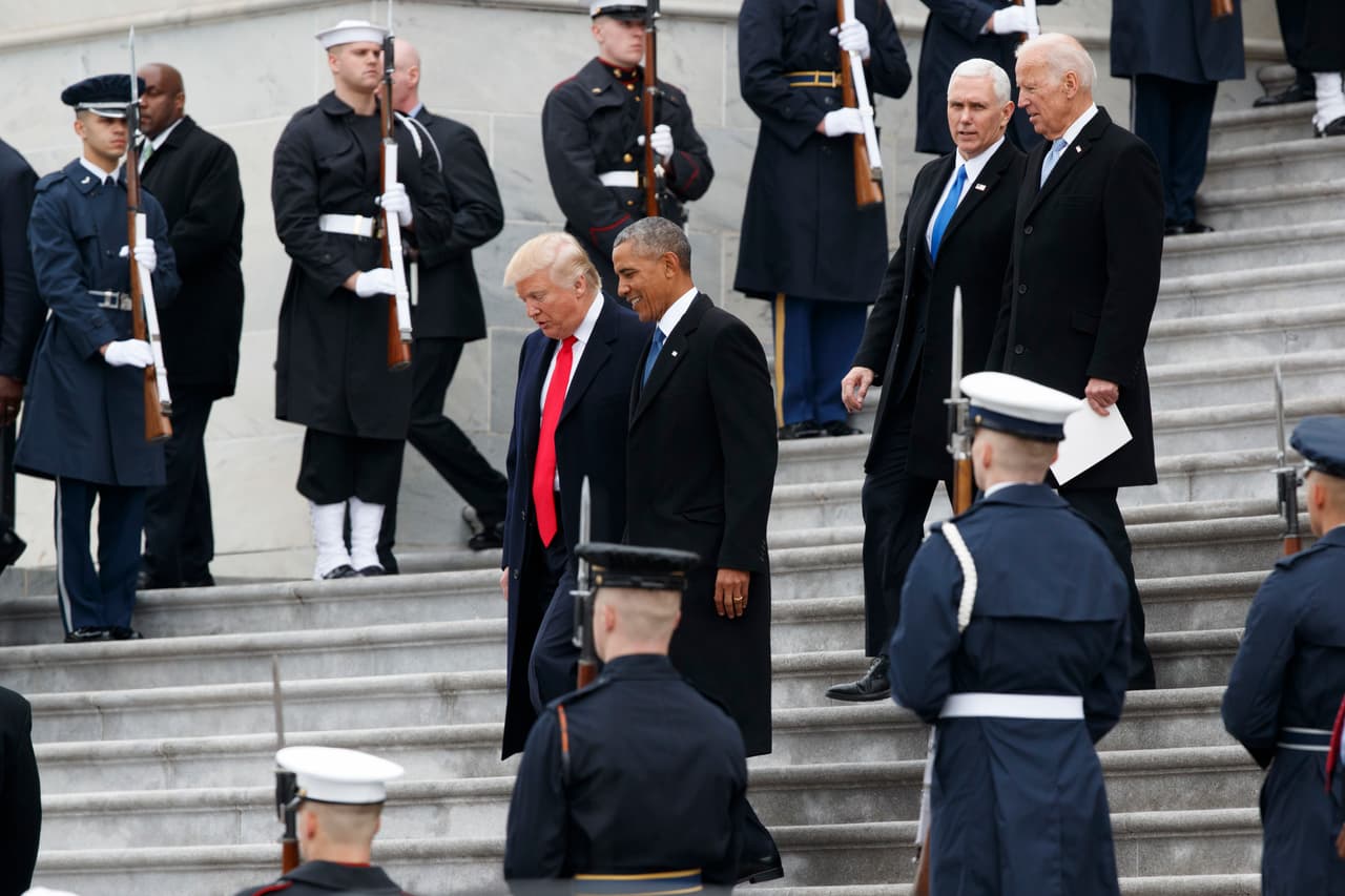 President Donald Trump, left, walks with former President Barack Obama, as Vice President Mike Pence and former Vice President Joe Biden follow down the steps of the Capitol building Friday, Jan. 20, 2017, in Washington. (AP Photo/Evan Vucci)