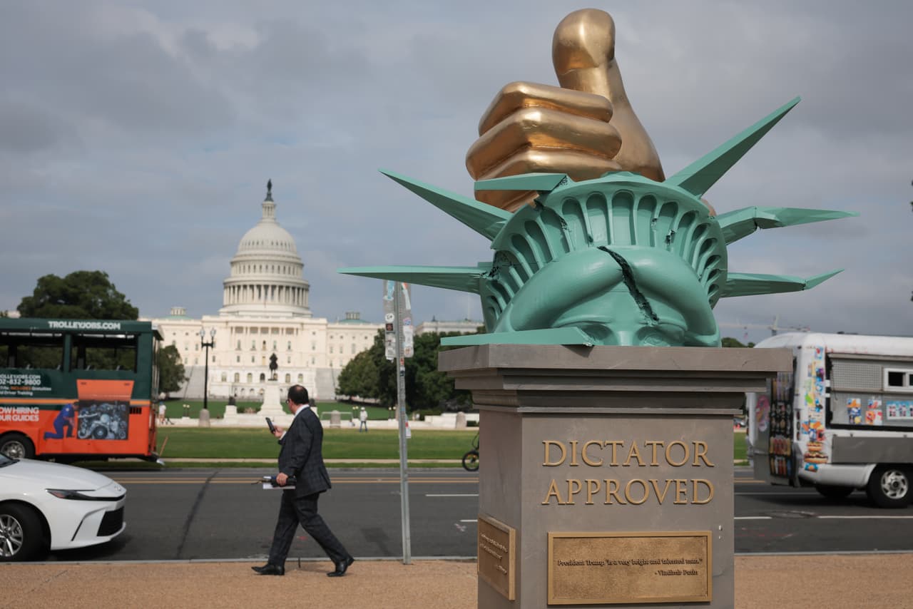 WASHINGTON, DC - JUNE 17: An anti-Trump art installation statue is seen in front of the U.S. Capitol on the National Mall on June 17, 2025 in Washington, DC. It's not known where the statue came from, which features a large "thumbs up" that is sitting on top of a broken Statue of Liberty with quotes surrounding the pedestal. (Photo by Kayla Bartkowski/Getty Images)