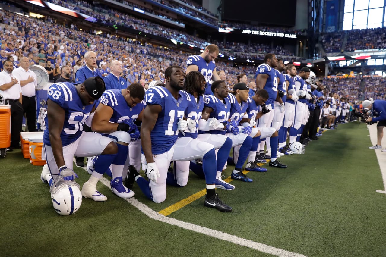 Members of the Indianapolis Colts take a knee during the Nation Anthem before an NFL football game against the Cleveland Browns in Indianapolis, Sunday, Sept. 24, 2017. (AP Photo/Darron Cummings)