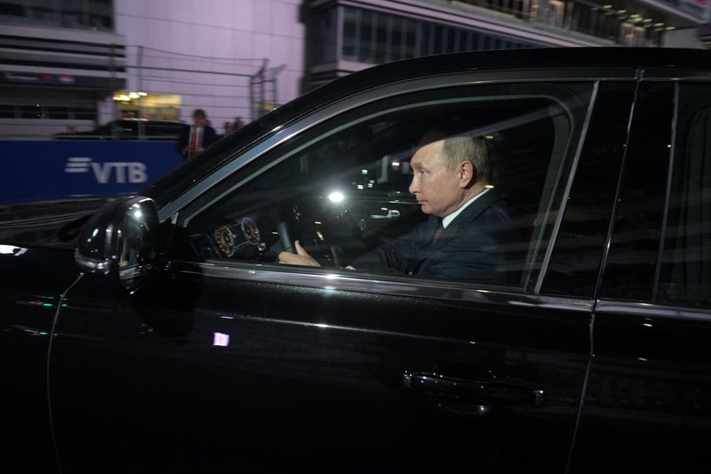 Russian President Vladimir Putin drives the Aurus presidential limousine at the Sochi's F1 race track on October 17, 2018.