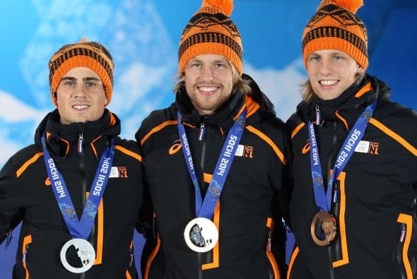 Jan Smeekens junto a los gemelos Mulder, Michel y Ronald.