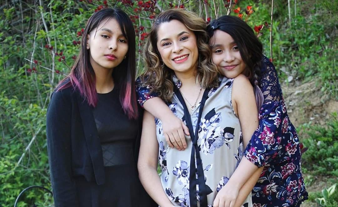 Maria Gomez, 34, was brought to Iowa from Guanajuato, Mexico, as a child and was abadnoned by her father. She is a now a member of the Columbus district school board and her husband is a former meat packing worker who still needs physical therapy for the years he spent working in the Tyson plant. In the photo with her two daughters.