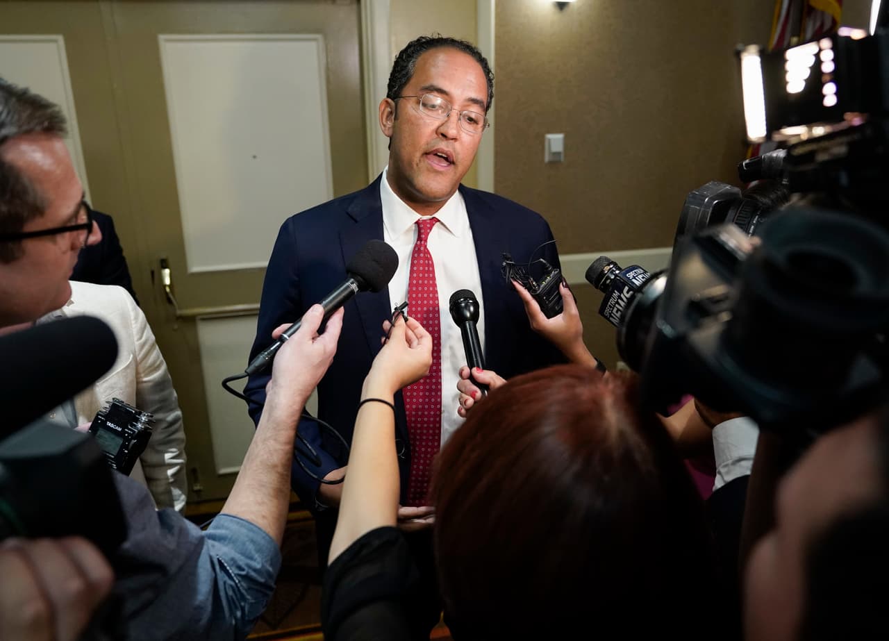 U.S. Rep. Will Hurd, R-Texas, speaks with members of the press during his election night victory party, Tuesday, Nov. 6, 2018, in San Antonio. Hurd defeated Democratic challenger Gina Ortiz Jones. (AP Photo/Darren Abate)