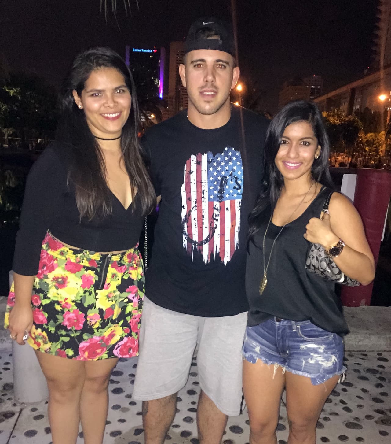 In this photo taken at 2:36 a.m. Sunday, Jose Fernandez poses with fans at the American Social Bar & Kitchen. The boat Fernandez was on crashed into a jetty of rocks around 3:30 a.m., according to the Coast Guard.