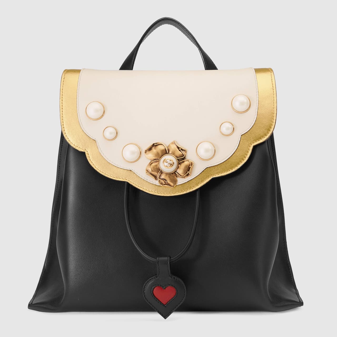 Mientras más compacto y rígido sea el backpack más sofisticado e ideal resultará para tus looks de gala. (Gucci).
<br>