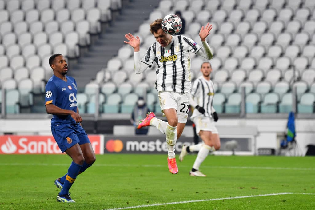 TURIN, ITALY - MARCH 09: Federico Chiesa of Juventus scores their side's second goal during the UEFA Champions League Round of 16 match between Juventus and FC Porto at Juventus Arena on March 09, 2021 in Turin, Italy. Sporting stadiums around Italy remain under strict restrictions due to the Coronavirus Pandemic as Government social distancing laws prohibit fans inside venues resulting in games being played behind closed doors. (Photo by Valerio Pennicino/Getty Images)