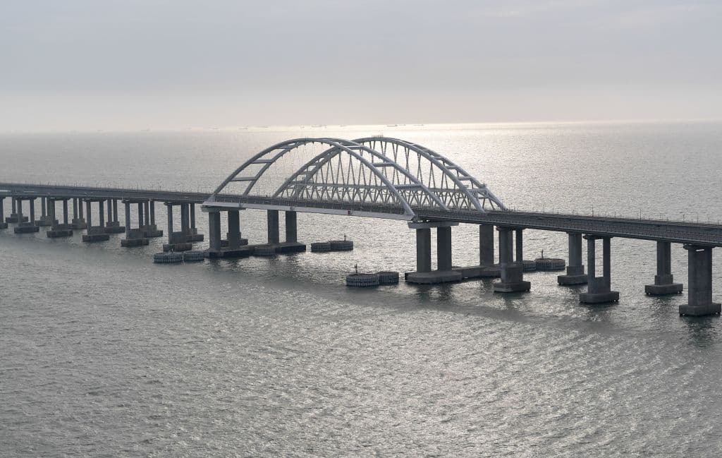 This picture taken on December 23, 2019, shows the Crimean Bridge that spans the Kerch Strait, a narrow strip that links the Azov and Black seas. Russian President Vladirmir Putin stood in the driver's cabin of a train for the official opening of a railway bridge that links annexed Crimea to southern Russia.