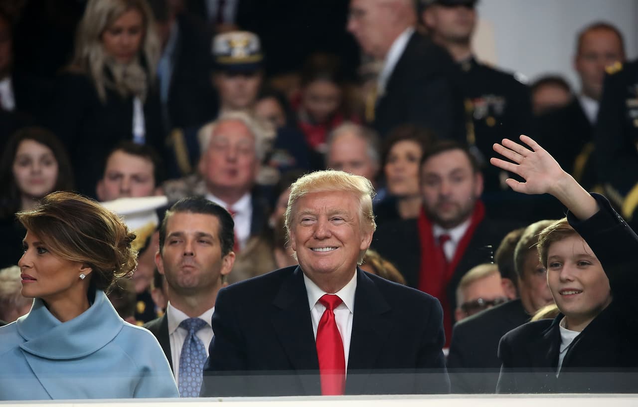 WASHINGTON, DC - JANUARY 20: U.S. President Donald Trump sits with his wife first lady Melania Trump and son Barron as the inaugural parade passes by on January 20, 2017 in Washington, DC. Donald Trump was sworn in as the nation's 45th president today. (Photo by Mark Wilson/Getty Images)