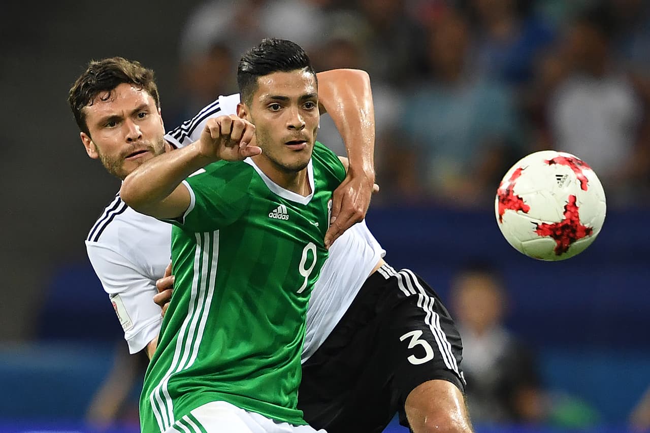 Mexico's forward Raul Jimenez (R) challenges Germany's defender Jonas Hector during the 2017 FIFA Confederations Cup semi-final football match between Germany and Mexico at the Fisht Stadium in Sochi on June 29, 2017. / AFP PHOTO / Kirill KUDRYAVTSEV (Photo credit should read KIRILL KUDRYAVTSEV/AFP/Getty Images)