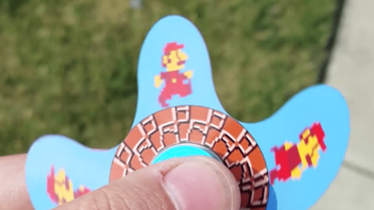 This running Super Mario fidget spinner is totally rad  