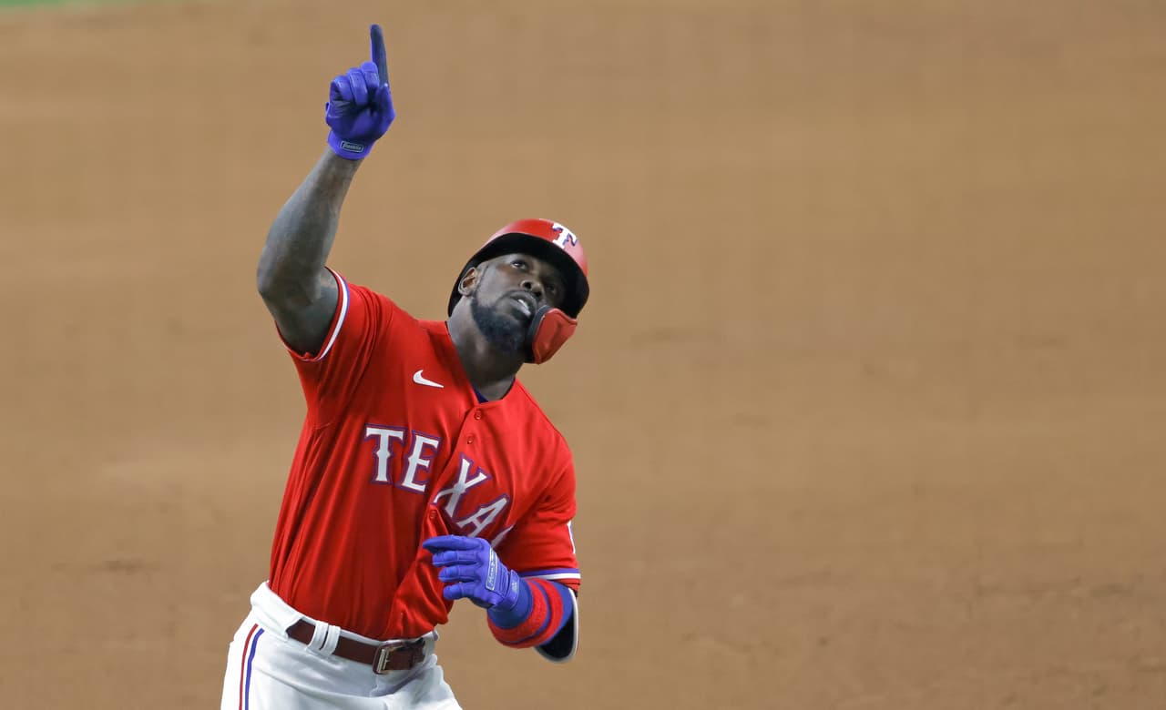 ARLINGTON, TX - JUNE 18: Adolis Garcia #53 of the Texas Rangers reacts after hitting a solo home run against the Minnesota Twins during the seventh inning at Globe Life Field on June 18, 2021 in Arlington, Texas. (Photo by Ron Jenkins/Getty Images)