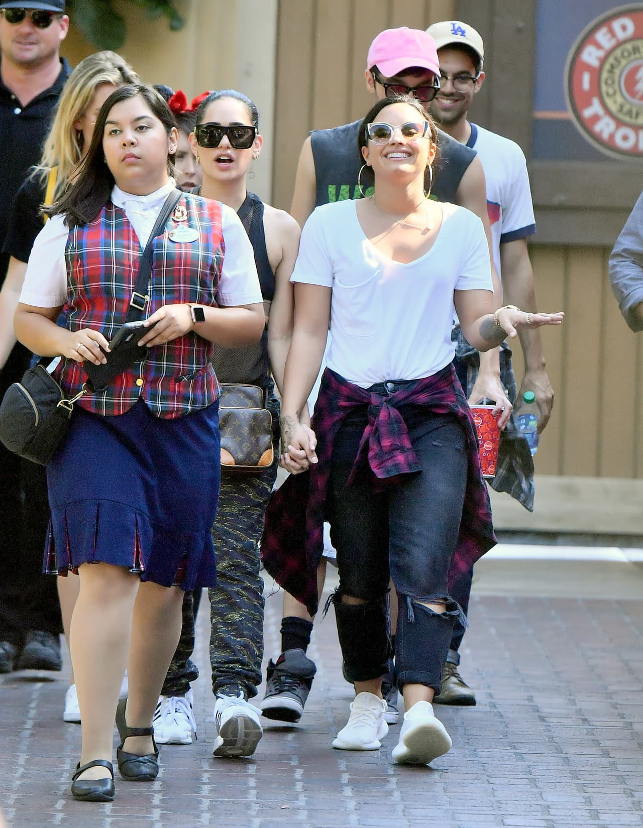Photo © 2017 Mega/The Grosby Group EXCLUSIVE Los Angeles, CA September 11, 2017 Demi Lovato holds hands with a mystery woman while spending a happy day a Disneyland gets photobombed by Donald Duck. Demi and her new lady walked hand in hand all day Long as they enjoyed a day. they were seen riding the California screaming rollercoaster. Demi looked extremely happy.