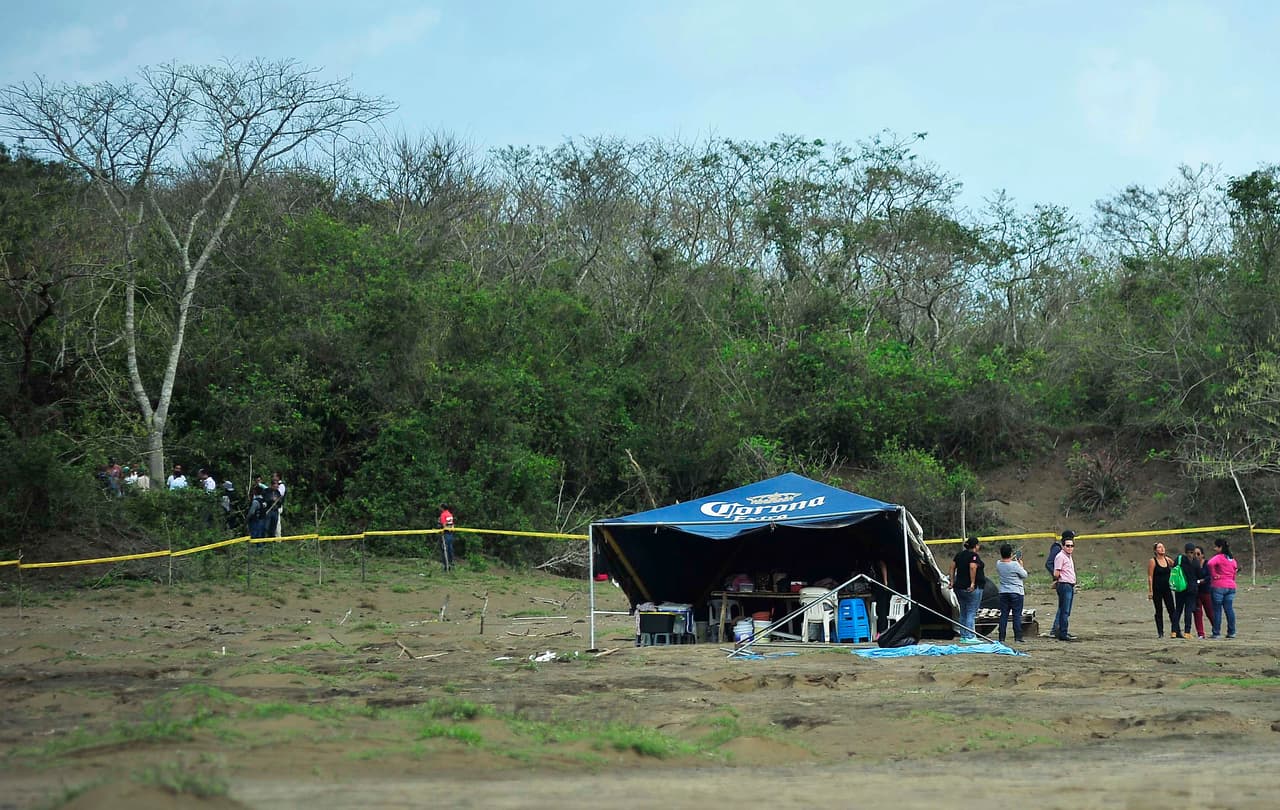 The relatives of the disappeared meet with investigators where human remains have been found. March 16, 2017.