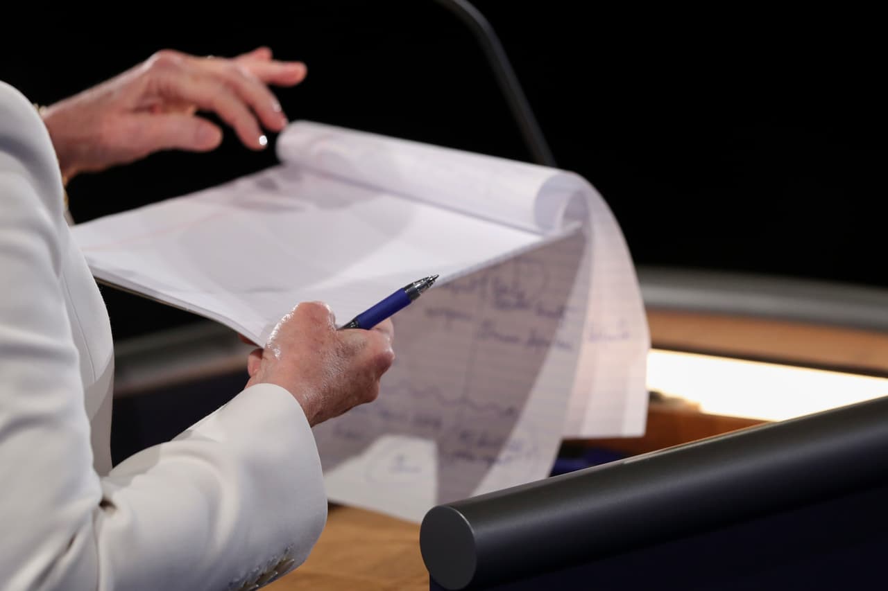 Democratic presidential nominee Hillary Clinton takes notes during the third presidential debate at UNLV in Las Vegas, Wednesday, Oct. 19, 2016. (Joe Raedle/Pool via AP)
