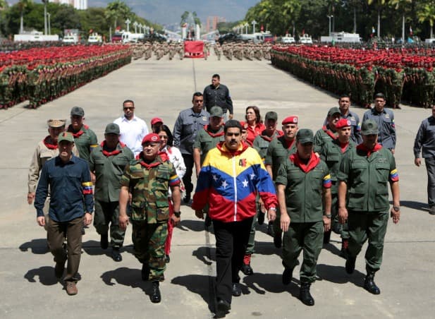 Venezuela's President Nicolas Maduro attends a military parade on February 4, 2015 to commemorate the 23rd anniversary of late President Hugo Chavez’s failed coup attempt in Caracas.