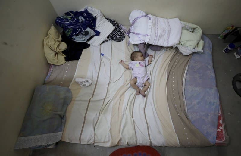 Two-month-old Zuleidy Primera sleeps at her migrant Venezuelan family's home in Cucuta.
