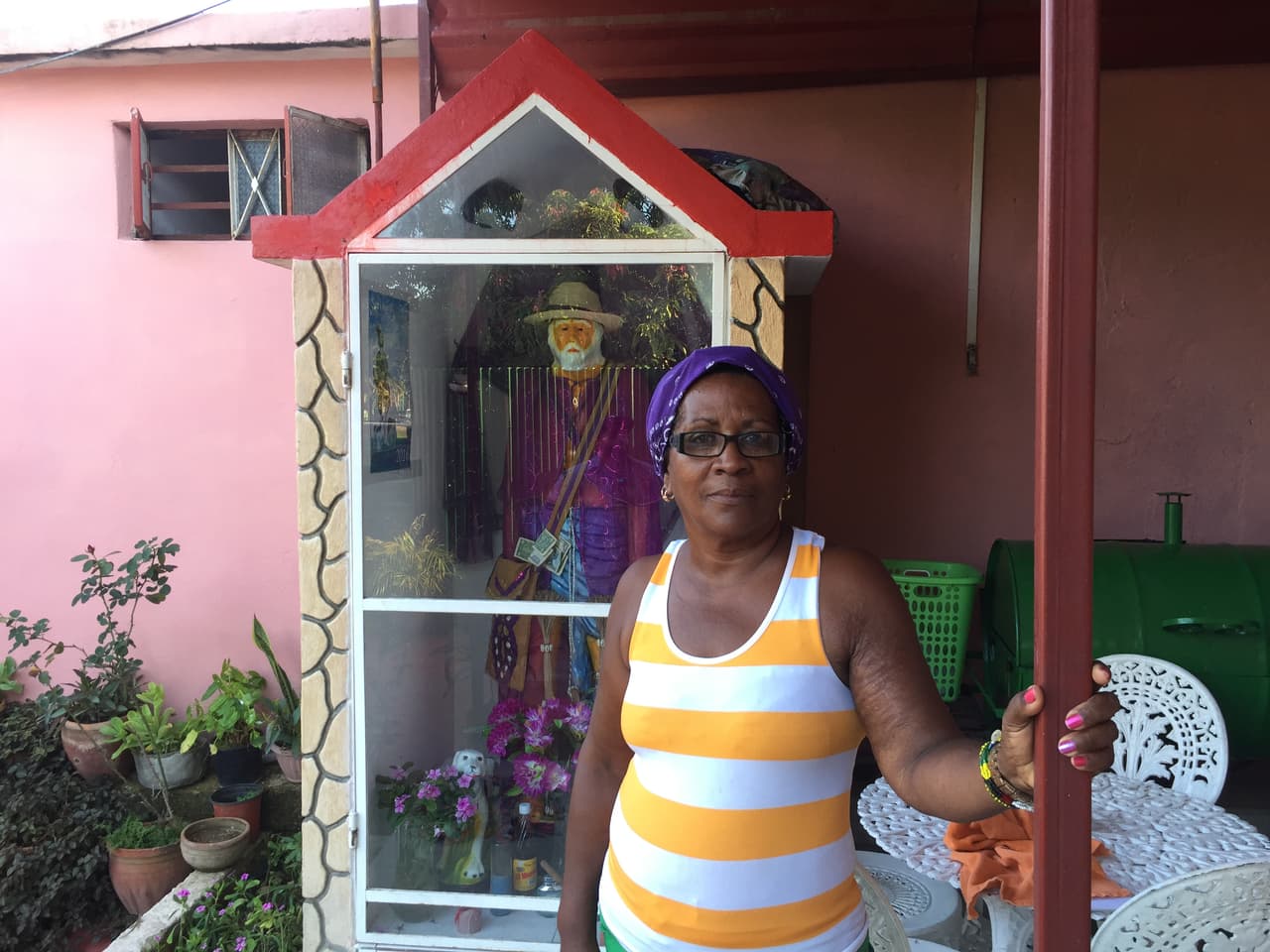 Caridad Guerrero is a devotee of Cuba's Afro-Cuban Yoruba faith. In her garden stands an image of Saint Lazarus, the healer God, Babalu-aye.