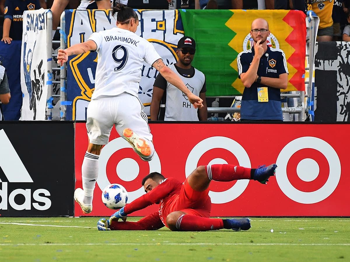Jul 29, 2018; Carson, CA, USA; Orlando City goalkeeper Earl Edwards Jr (36) makes a save off Los Angeles Galaxy forward Zlatan Ibrahimovic (9) as he heads toward the goal in the first half at StubHub Center. Mandatory Credit: Jayne Kamin-Oncea-USA TODAY Sports
