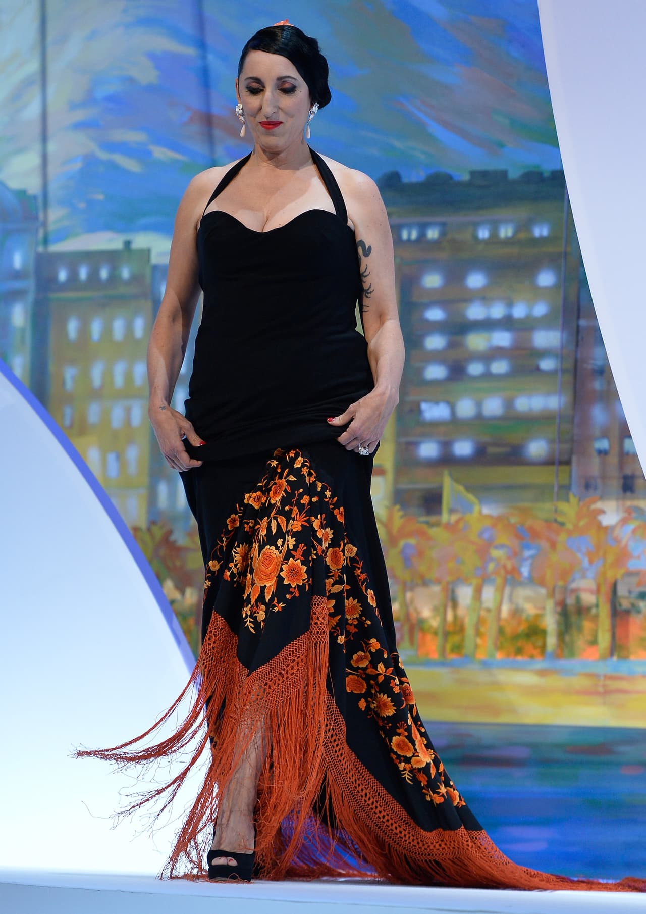 De Palma también tiene una presencia en la industria de la moda: ha trabajado de la mano de diseñadores de Jean Paul Gautier y desfilado por las pasarelas de la Semana de la Moda en Madrid en varias ocasiones.