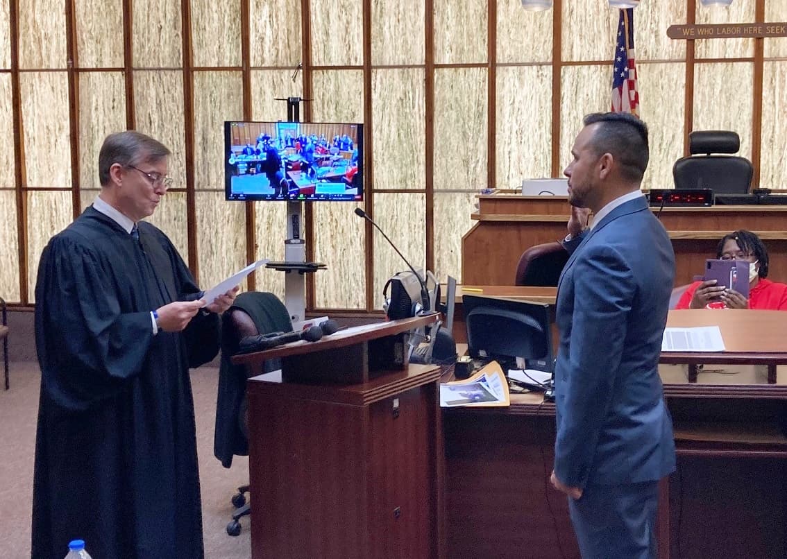 Florida Circuit Judge Miguel de la O swears in former convict, Angel Sanchez, after his admission to the Washington DC bar. The ecremony took place in the same Miami courthouse where Sanchez was sentenced to 30 years in prison in in 1999. Sept 16, 2022.