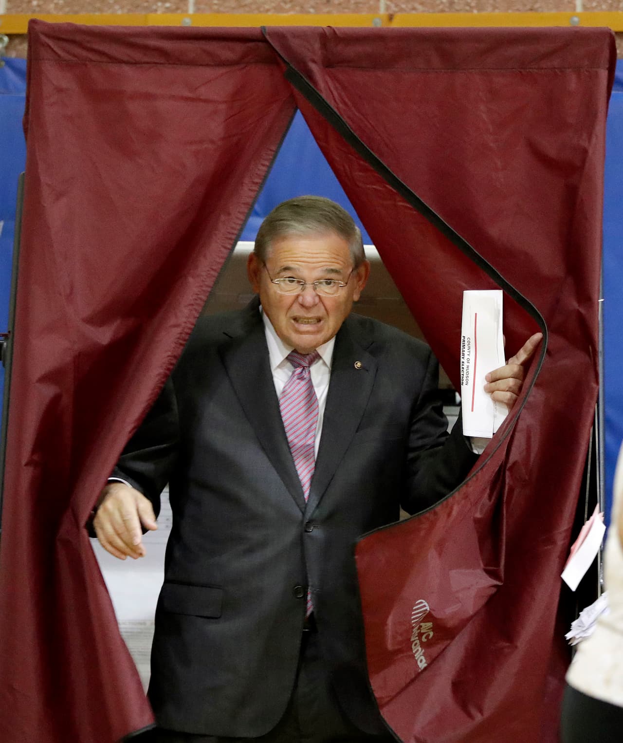 U.S. Sen. Bob Menendez exits a polling booth after casting his vote in the New Jersey Primary Election, Tuesday, June 5, 2018, at the Harrison Community Center in Harrison, N.J. (AP Photo/Julio Cortez)