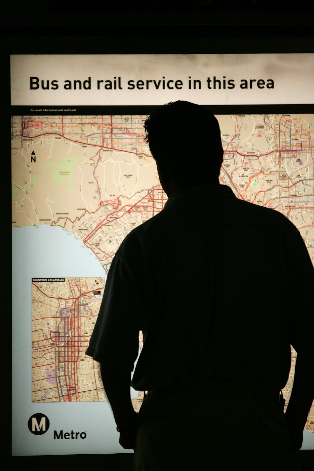LOS ANGELES, CA - JUNE 3: A passenger looks at a Metro Rail subway train map during rush hour June 3, 2008 in Los Angeles, California. Skyrocketing gas prices are driving more commuters to take trains and buses to work instead of their cars. In the first three months of 2008, the number of trips taken on public transport in the US rose 3 percent to 2.6 billion, creating pressures on some transportation systems to cope with increasing ridership. Transit officials in southern California and elsewhere are now encouraging employers to stagger employee schedules to ease the rush hour crunch on trains and buses and Metrolink plans to add 107 rail cars to its fleet of 155 as soon as next year. (Photo by David McNew/Getty Images)