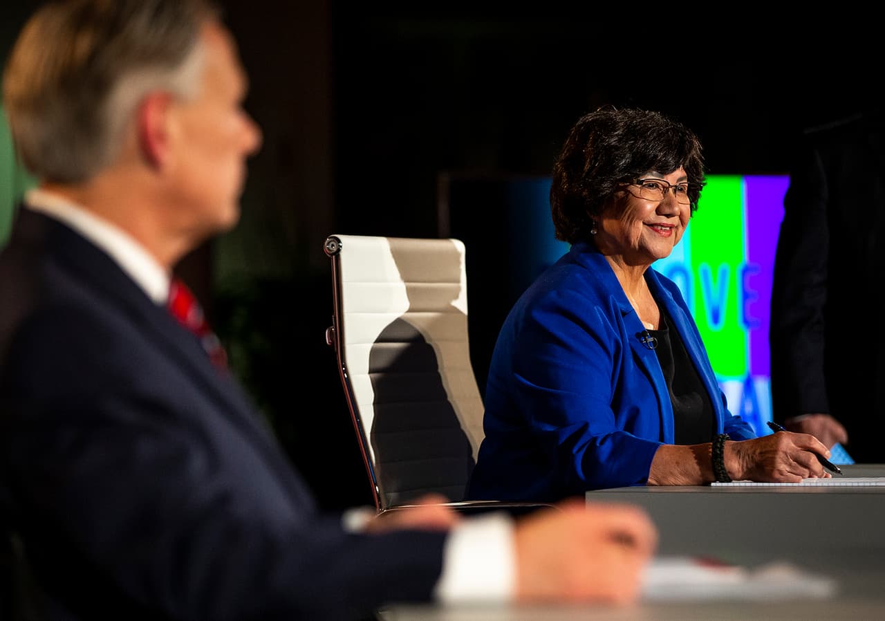 Democratic candidate for governor Lupe Valdez, right, smiles before a debate against Gov. Greg Abbot, left, at the LBJ Library in Austin, Texas, on Friday, Sept. 28, 2018. (Nick Wagner/Austin American-Statesman via AP, Pool)