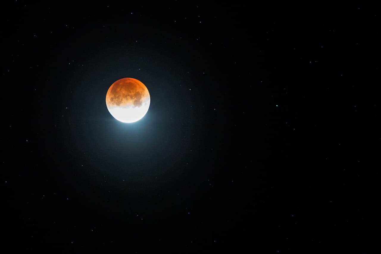 AMBOY, CA - JANUARY 31: A so-called 'super blue blood moon' is seen in total eclipse above the Mojave Desert on January 31, 2018 near Amboy, California. The 'Super Blue Blood Moon' is a rare 'lunar trifecta' event in which the Moon is at its closest to the Earth, appearing slightly bigger and about 14 percent brighter than usual, and is simultaneously a 'blue moon', the second full moon in the same month, and in total lunar eclipse or 'blood moon'. Such a lunar event that hasn't been seen since 1866. (Photo by David McNew/Getty Images)