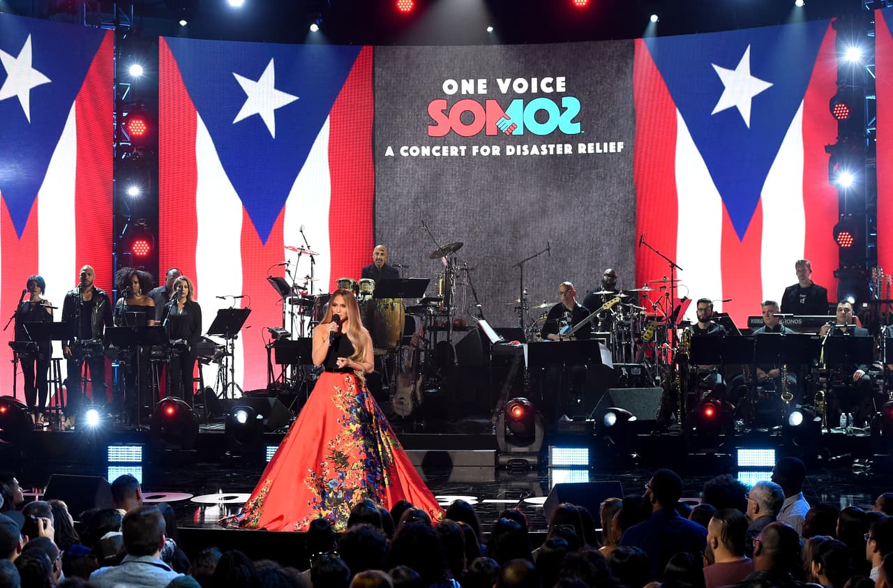 LOS ANGELES, CA - OCTOBER 14: In this handout photo provided by One Voice: Somos Live!, singer Jennifer Lopez speaks onstage during "One Voice: Somos Live! A Concert For Disaster Relief" at the Universal Studios Lot on October 14, 2017 in Los Angeles, California. (Photo by Kevin Winter/One Voice: Somos Live!/Getty Images)